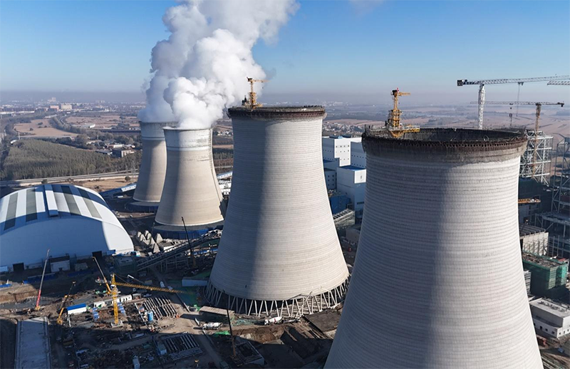 筑顶冰城暖源！国能哈热二期项目3号排烟冷却塔顺利封顶